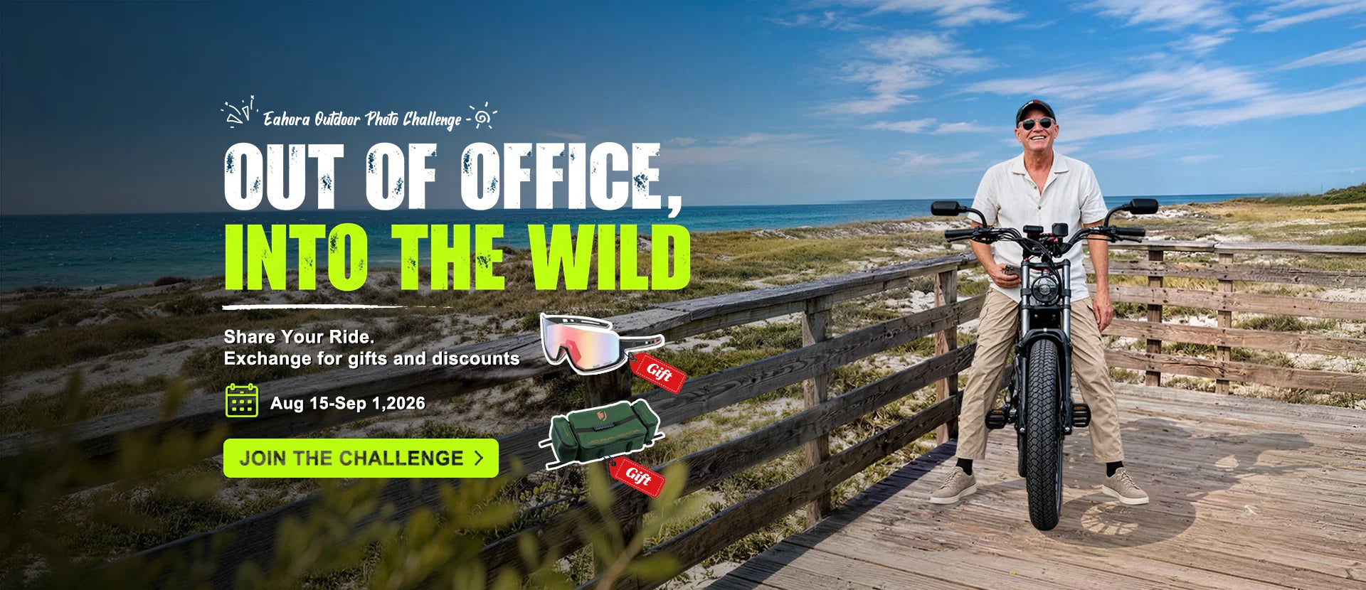 A man wearing sunglasses and a white shirt stands on a wooden boardwalk by the ocean, holding a cruiser motorcycle. Large promotional text reads 'OUT OF OFFICE, INTO THE WILD' with event details and small product callouts for sunglasses, a backpack, and a helmet.